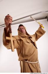 JOEL_ADAMSON WITH CRUCIFIX AND SWORD